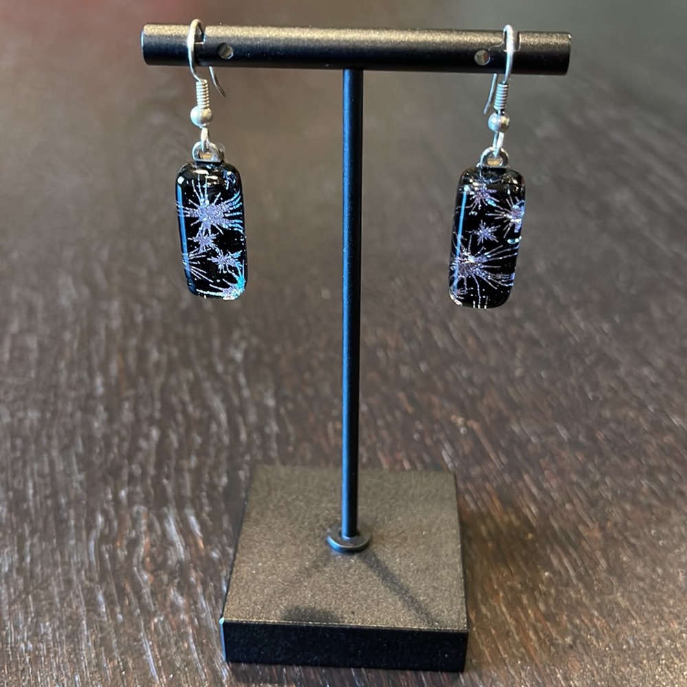 Black & silver star design in glass pierced earrings for day or evening use